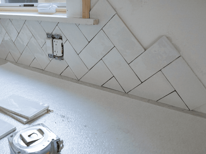 Installing herringbone kitchen backsplash pattern